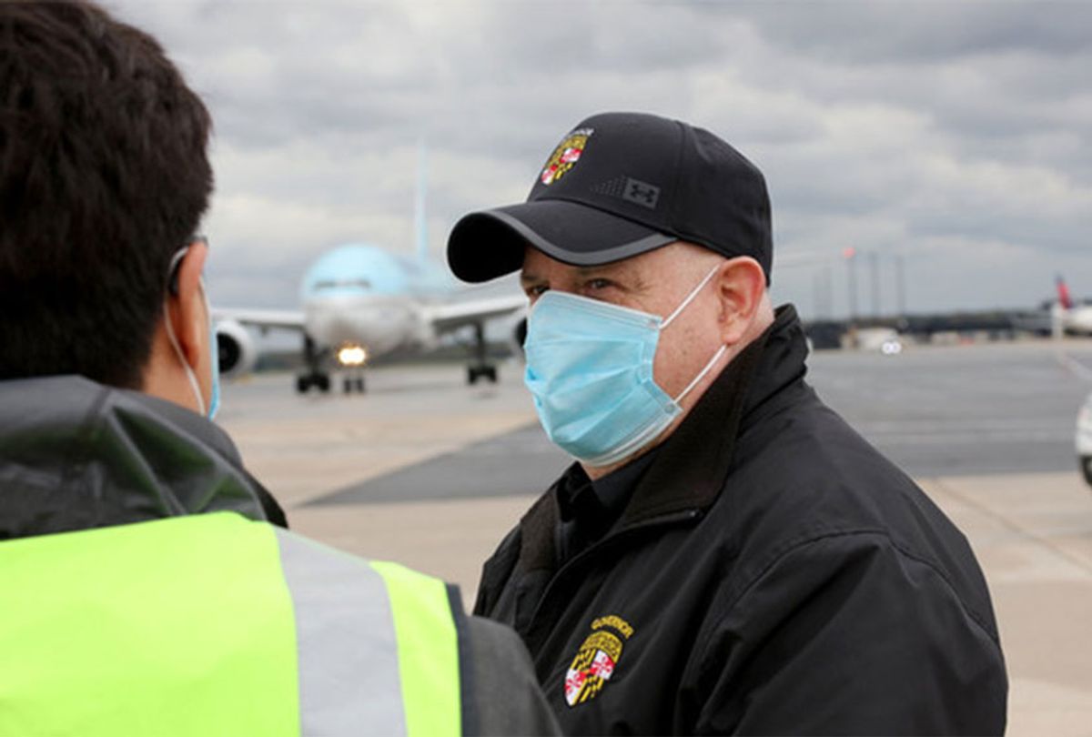 Maryland Governor Larry Hogan and First Lady Yumi Hogan welcome a Korean Air passenger plane carrying a load of COVID-19 test kits on Saturday, April 18.  (Office of the Governor)