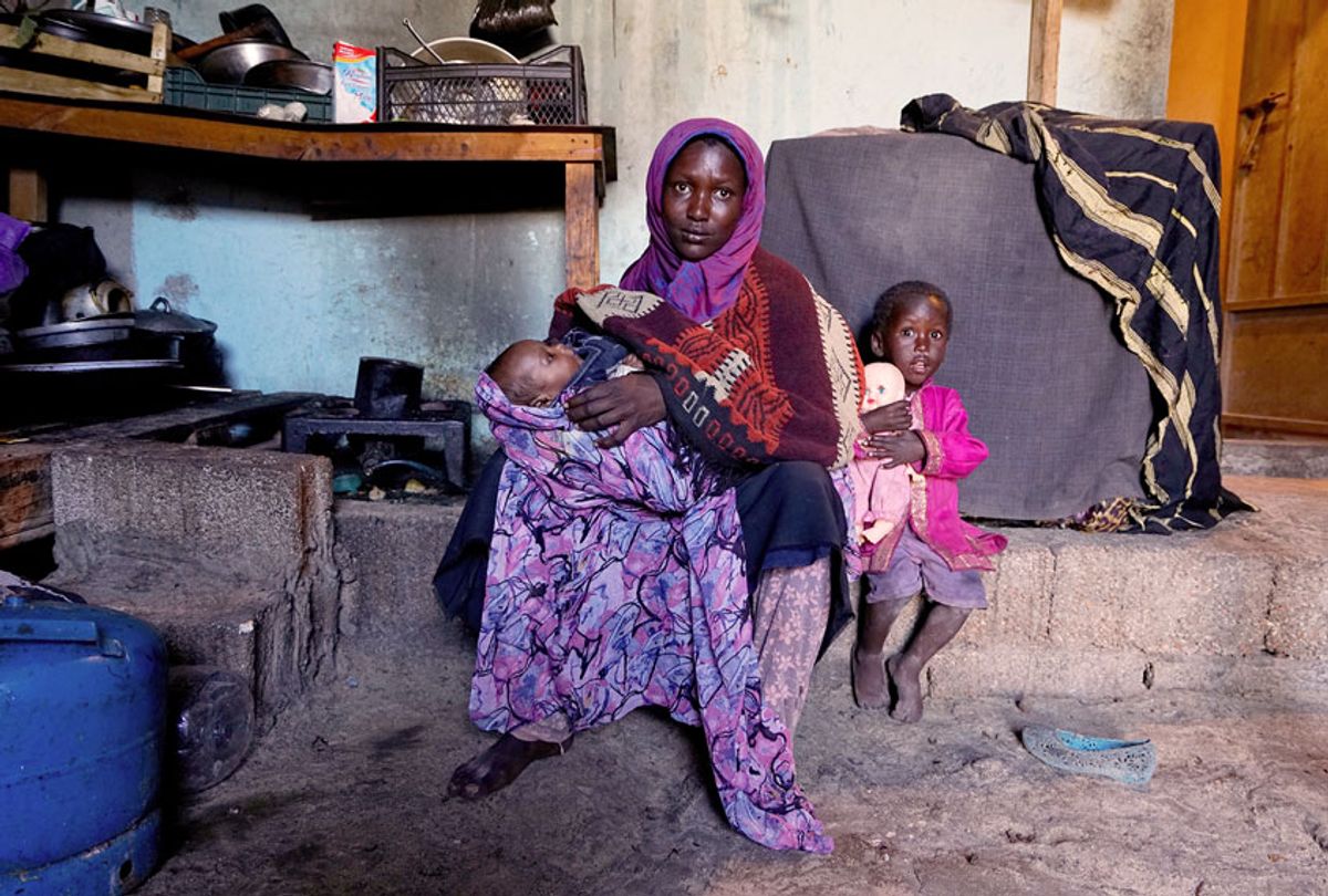 Maryar has three children from a husband who left her about a year ago to return to Darfur. She lives in the shack with another elder relative and her children. (Giles Clarke/UNOCHA via Getty Images)