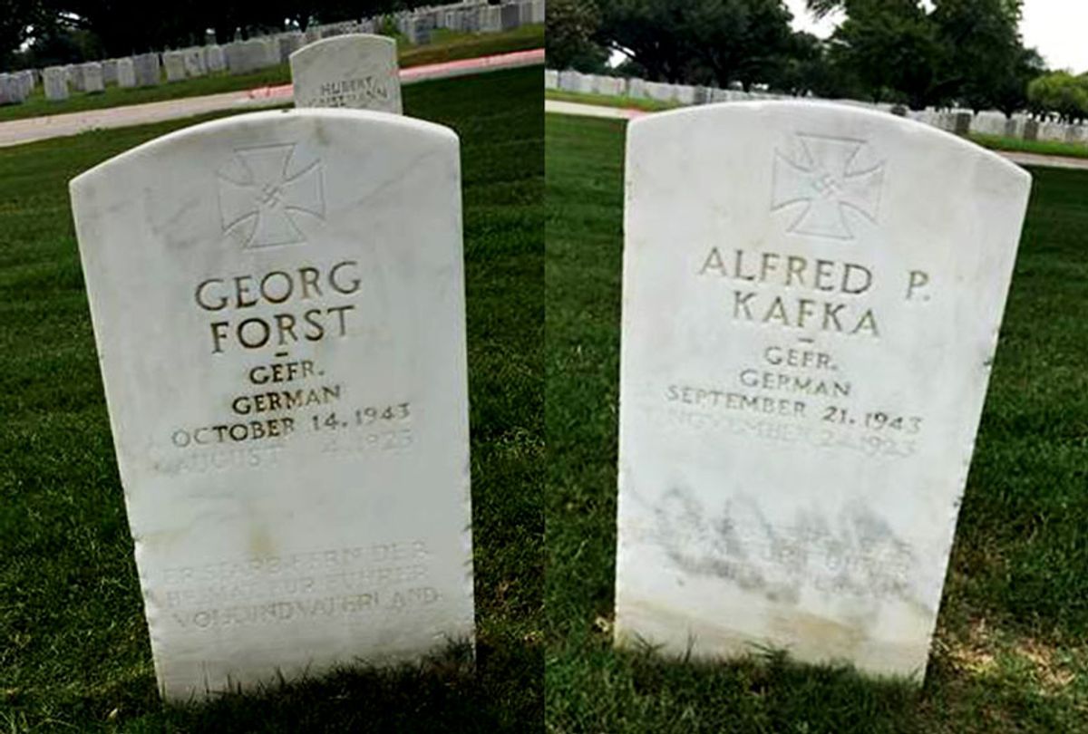 Two Nazi POW gravestones in Fort Sam Houston National Cemetery. At the top of the headstone one can readily see the Nazi Iron Cross with the swastika inscribed inside the Iron Cross. The inscription honoring Adolf Hitler is at the bottom of the headstone. (The Military Religious Freedom Foundation)