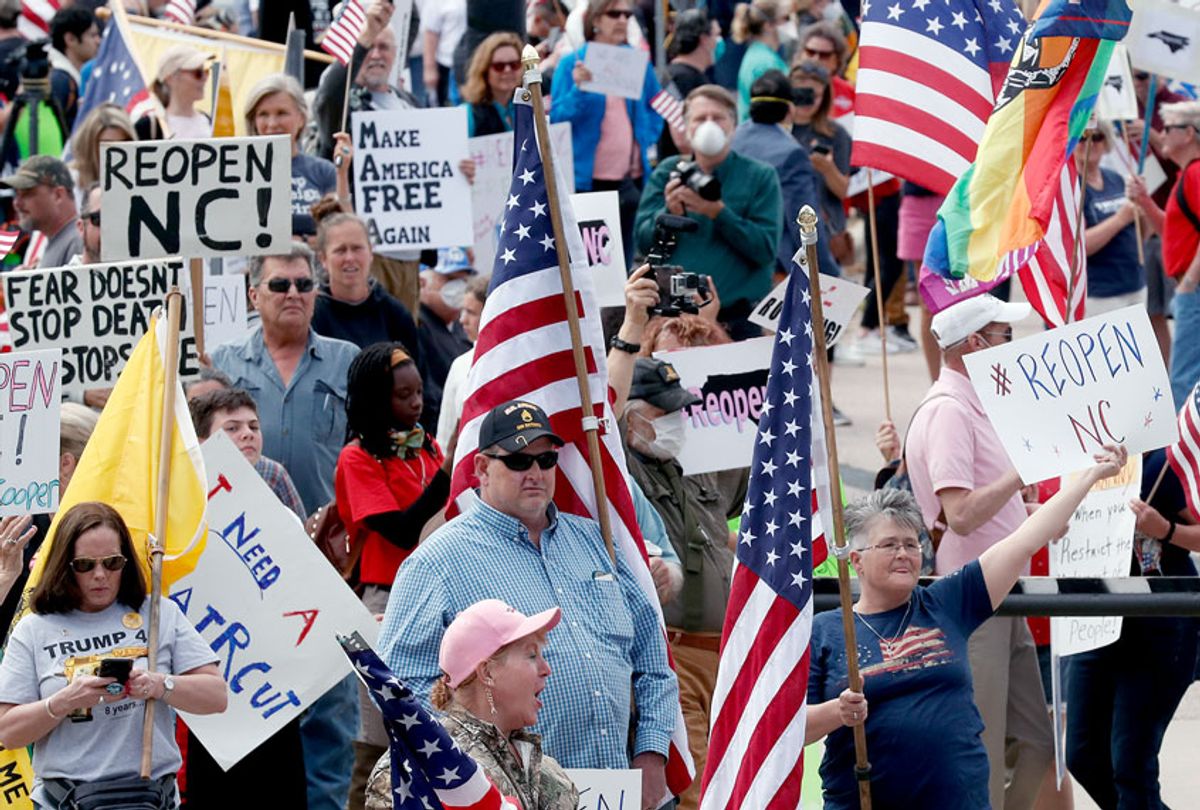 People gather with ReopenNC in Raleigh, N.C., as the group presses Gov. Roy Cooper to allow businesses to reopen during the COVID-19 outbreak. (AP Photo/Gerry Broome)