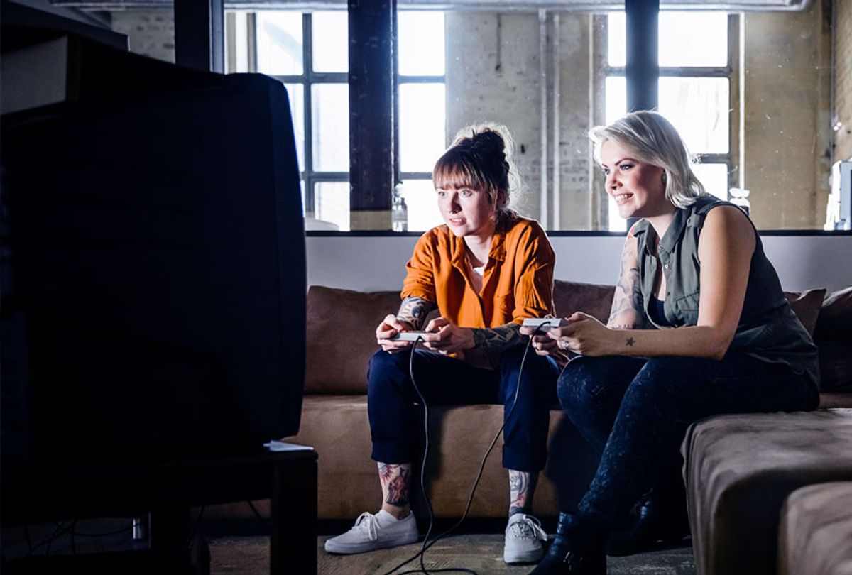 Two women playing a video game on a tv screen  (Getty Images/Hinterhaus Productions)