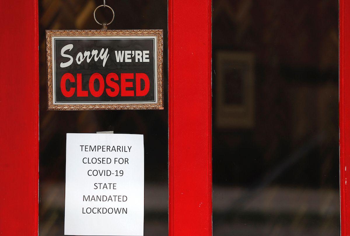 A sign in the widow of The Framing Gallery shows they are closed due to the new coronavirus COVID-19 pandemic, in Grosse Pointe, Mich., Thursday, May 7, 2020. (Paul Sancya/AP Photo)