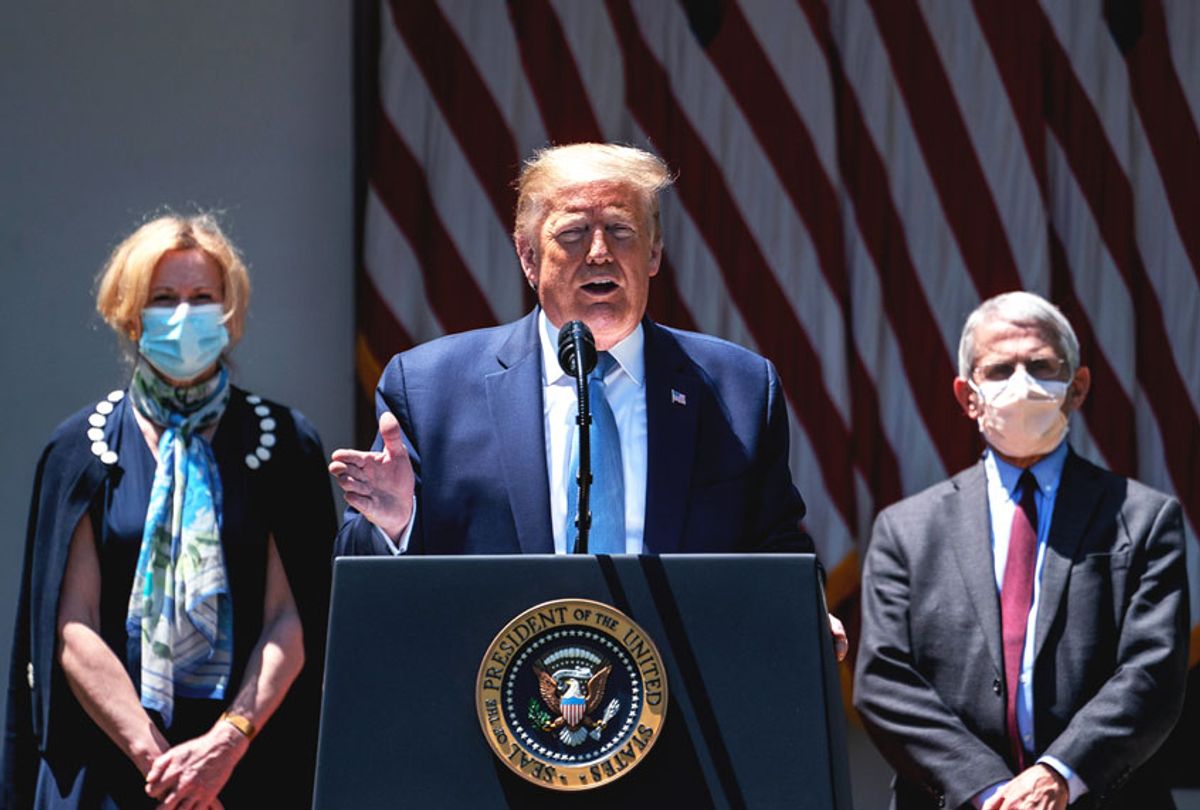 Flanked by White House coronavirus response coordinator Dr. Deborah Birx (L) and Dr. Anthony Fauci (R), director of the NIH, U.S. President Donald Trump delivers remarks about coronavirus vaccine development in the Rose Garden of the White House (Drew Angerer/Getty Images)