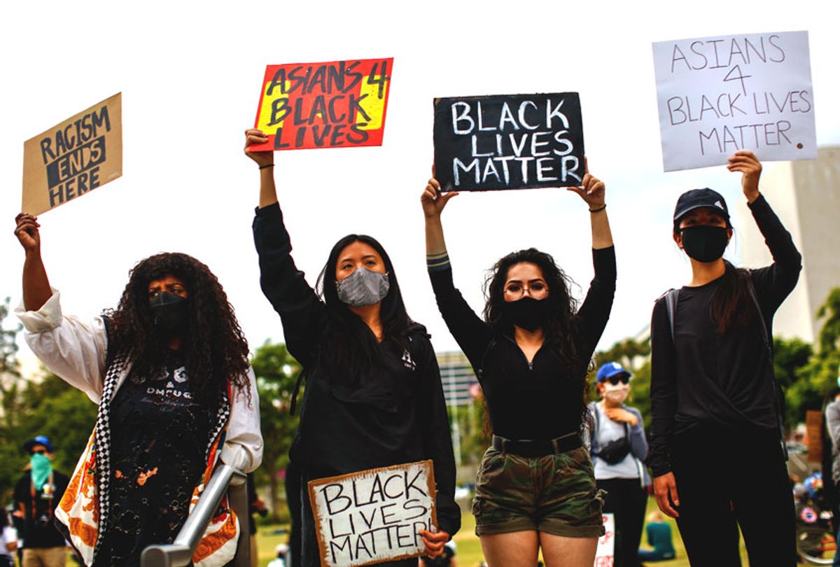 Friends, from left, Sheba Sahlemariam, from Los Angeles, Vicky Van, from San Gabriel, Raven Ramos, from Culver City and Jasmine chow, from San Gabriel, joined nearly 1,000 people gathered to protest the death of George Floyd and in support of Black Lives Matter, in downtown, Los Angeles, CA, on Friday, June 5, 2020. (Jay L. Clendenin / Los Angeles Times via Getty Images)