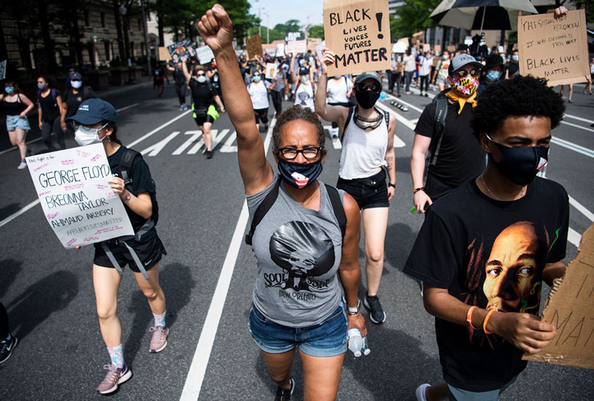 Demonstrators march on Pennsylvania Avenue towards the Capitol to protest the death of George Floyd (Tom Williams/CQ-Roll Call, Inc via Getty Images)