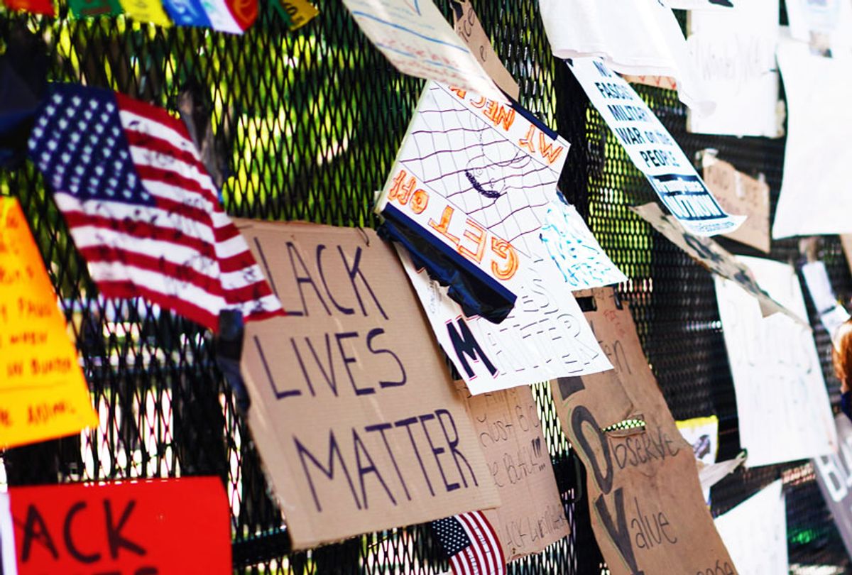 Posters and placards on the security fence on the north side of Lafayette Square, near the White House, in Washington, DC  (Getty Images)