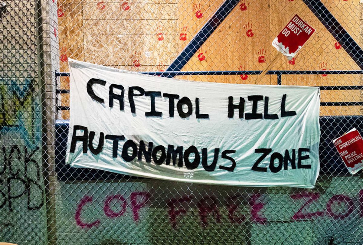 A "Capitol Hill Autonomous Zone" sign hangs on the exterior of the Seattle Police Departments East Precinct on June 9, 2020 in Seattle, Washington. (David Ryder/Getty Images)