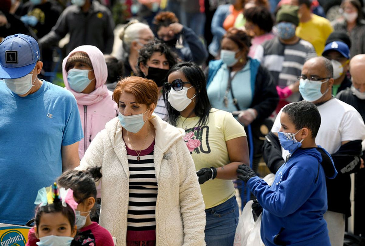A large group of people wearing medical face masks amidst the novel Coronavirus outbreak (Ben Hasty/MediaNews Group/Reading Eagle via Getty Images)