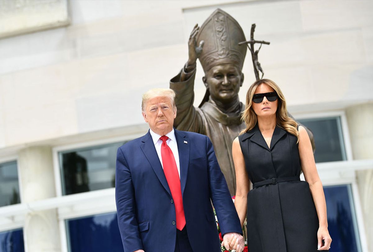 US President Donald Trump and First Lady Melania Trump visit the Saint John Paul II National Shrine, to lay a ceremonial wreath and observe a moment of remembrance under the Statue of Saint John Paul II on June 2, 2020 in Washington,DC. (BRENDAN SMIALOWSKI/AFP via Getty Images)