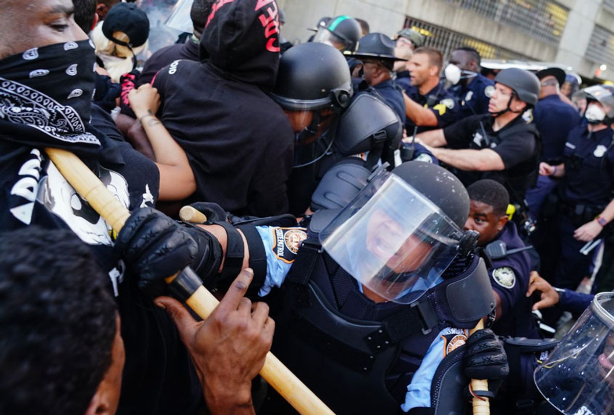 Police officers clash with protesters during a demonstration over the Minneapolis death of George Floyd while in police custody on May 29, 2020 in Atlanta, Georgia.  (Elijah Nouvelage/Getty Images)