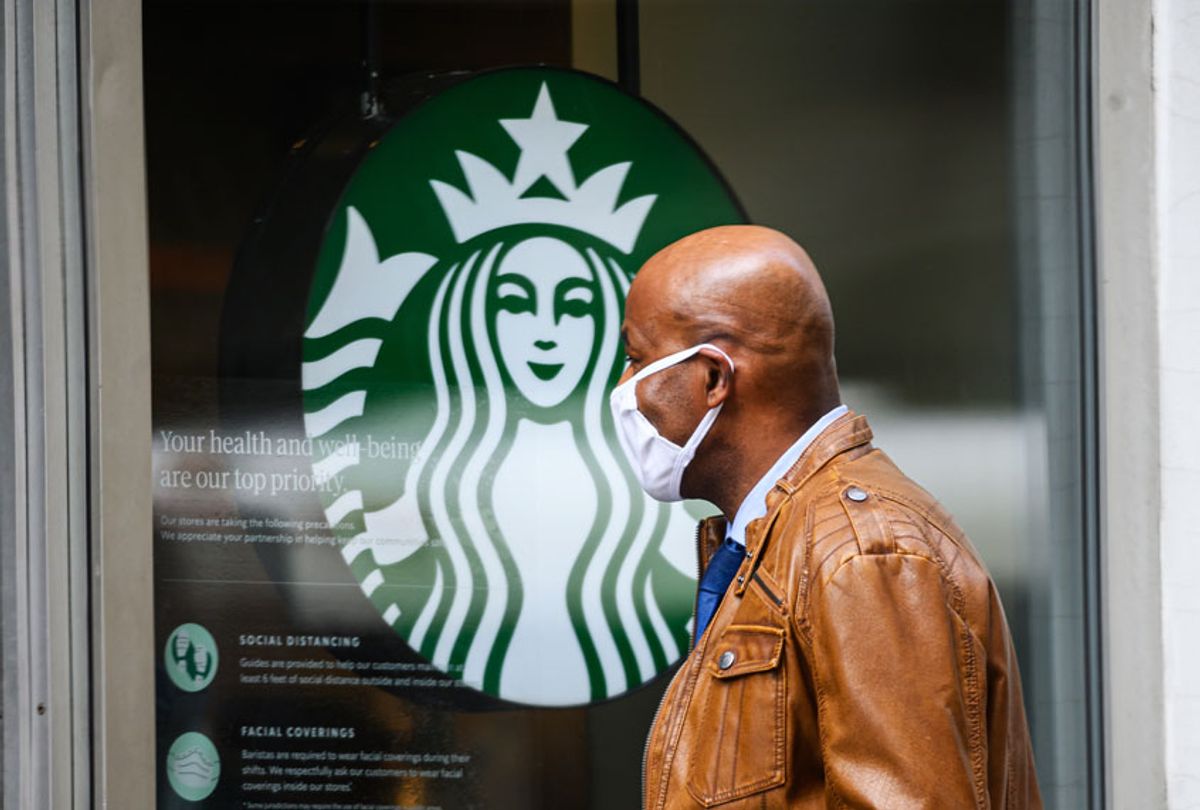 A person wears a protective face mask outside Starbucks in midtown during the coronavirus pandemic in New York City. (Getty Images)