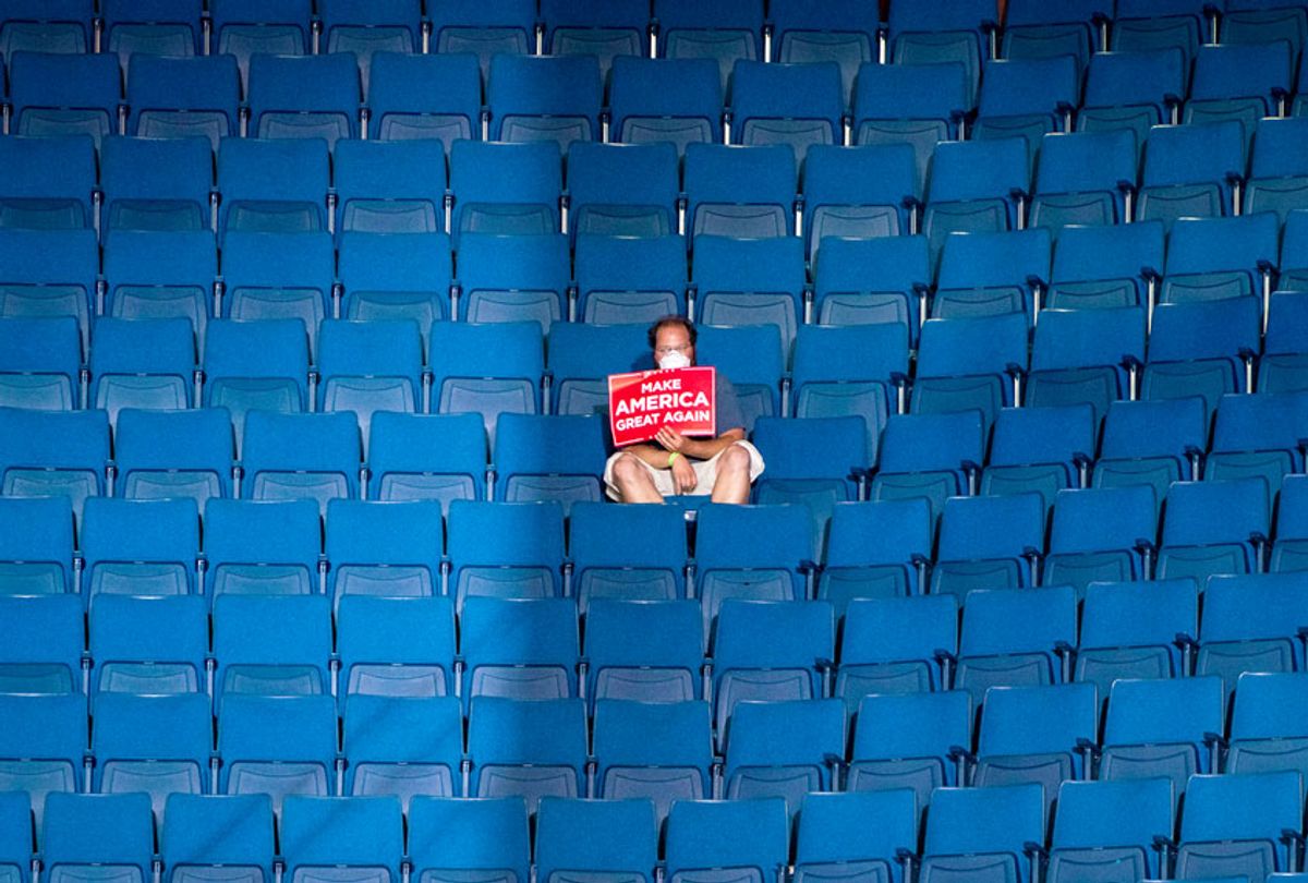 A supporter sits alone in the top sections of seating as Vice President Mike Pence speaks before President Donald J. Trump arrives for a "Make America Great Again!" rally at the BOK Center on Saturday, June 20, 2020 in Tulsa, OK. (Jabin Botsford/The Washington Post via Getty Images)