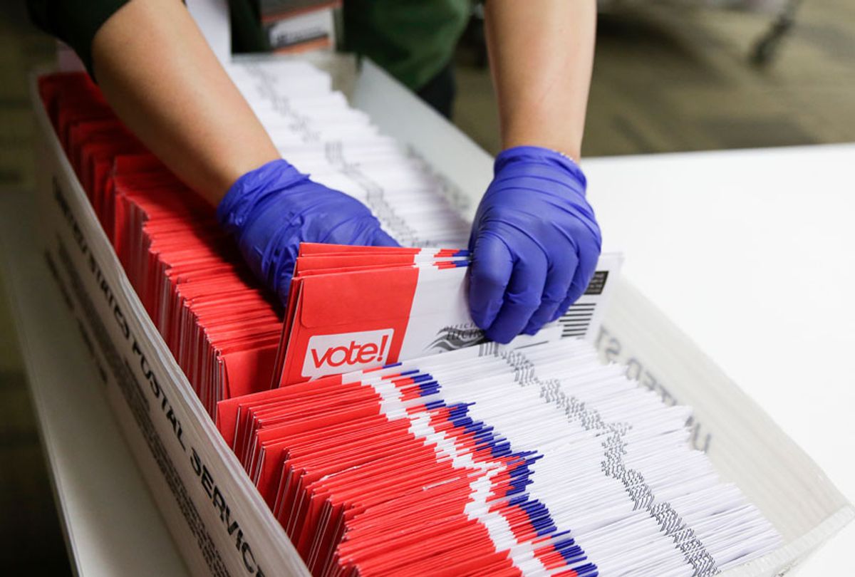 lection workers sort vote-by-mail ballots for the presidential primary (JASON REDMOND/AFP via Getty Images)