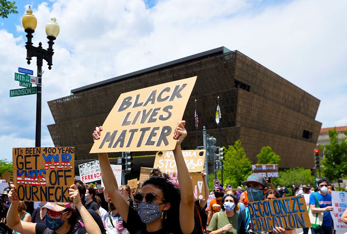 People march from The National Museum of African American History and Culture to the Martin Luther King Jr. Memorial to mark the Juneteenth holiday June 19, 2020 in Washington, DC. (Chip Somodevilla/Getty Images)