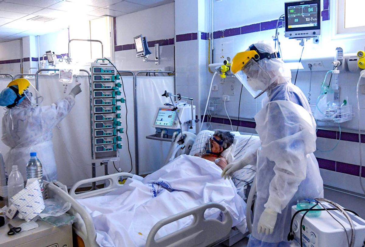 A patient infected by the covid-19 caused by the novel coronavirus receives treatment at the intensive care unit of a hospital in the southwestern Tunisian town of Gabes on August 26, 2020, as cases of infection surge there.  (FETHI BELAID/AFP via Getty Images)