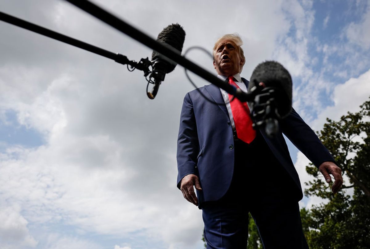 U.S. President Donald Trump stops to talk to reporters as he departs the White House (Samuel Corum/Getty Images)