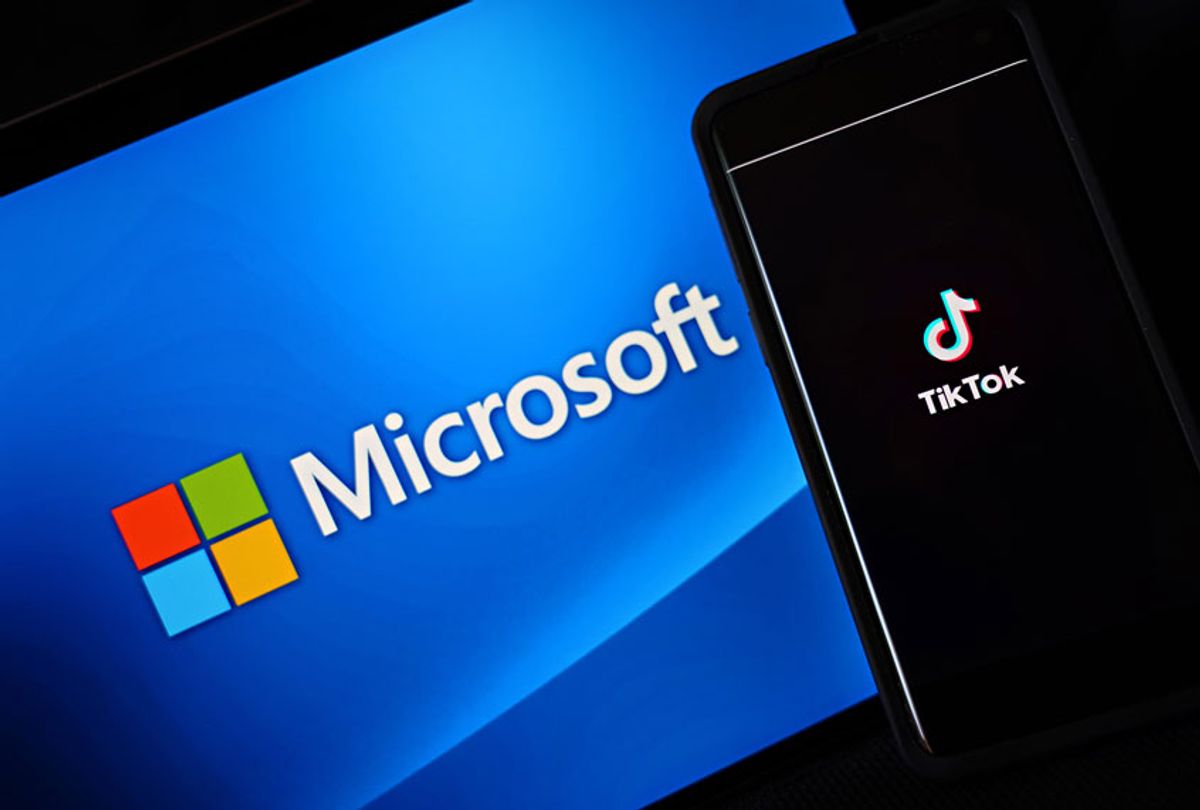 A mobile phone featuring the TikTok app is displayed next to the Microsoft logo on August 03, 2020 in New York City. Under threat of a U.S. ban on the popular social media app, it has been reported that Microsoft is considering taking over from Chinese firm ByteDance. (Illustration by Cindy Ord/Getty Images)