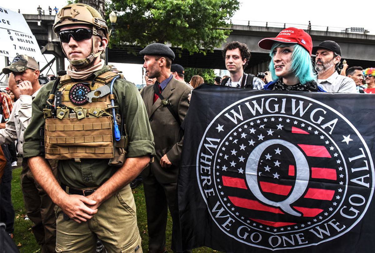 A person holds a banner referring to the Qanon conspiracy theory during a alt-right rally on August 17, 2019 in Portland, Oregon (Stephanie Keith/Getty Images)