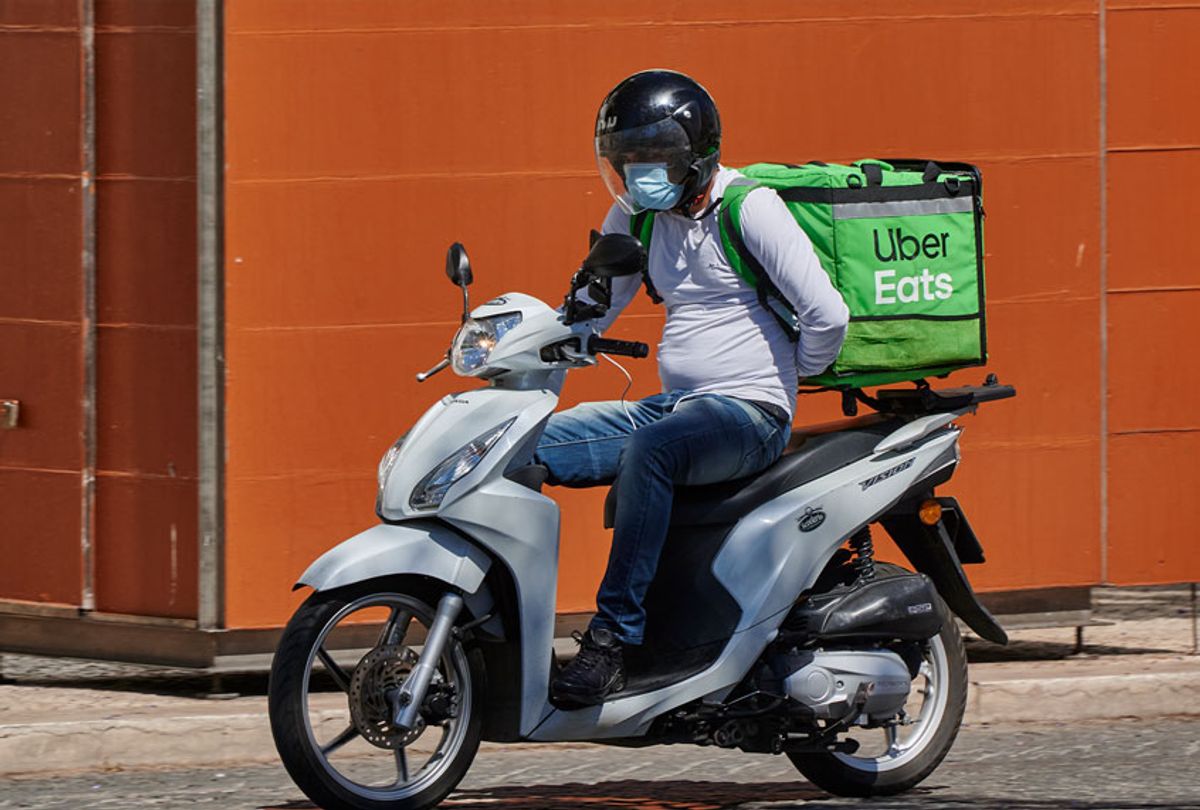 An Uber Eats delivery person (Horacio Villalobos/Corbis via Getty Images)