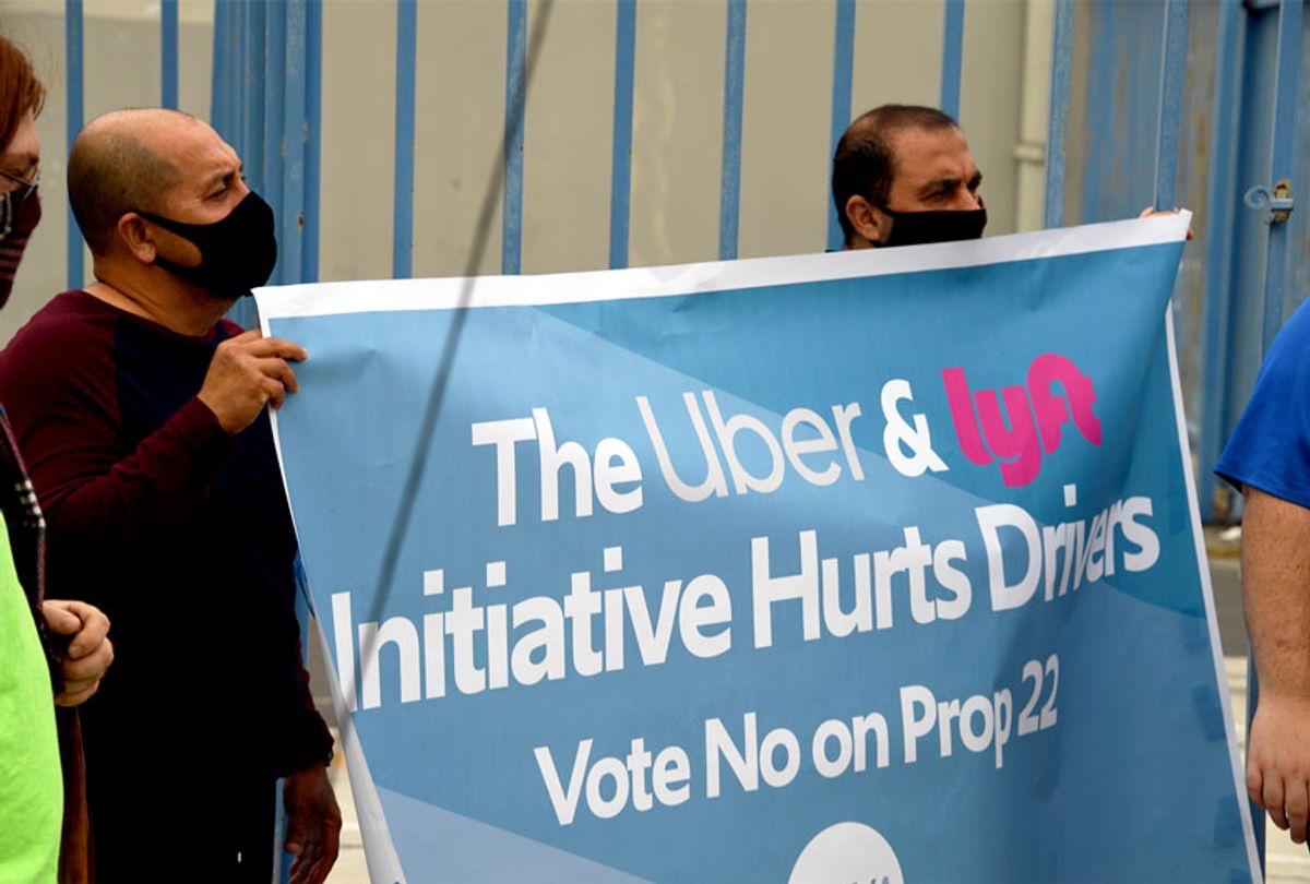 Rideshare drivers demonstrate against rideshare companies Uber and Lyft during a car caravan protest on August 6, 2020 (ROBYN BECK/AFP via Getty Images)