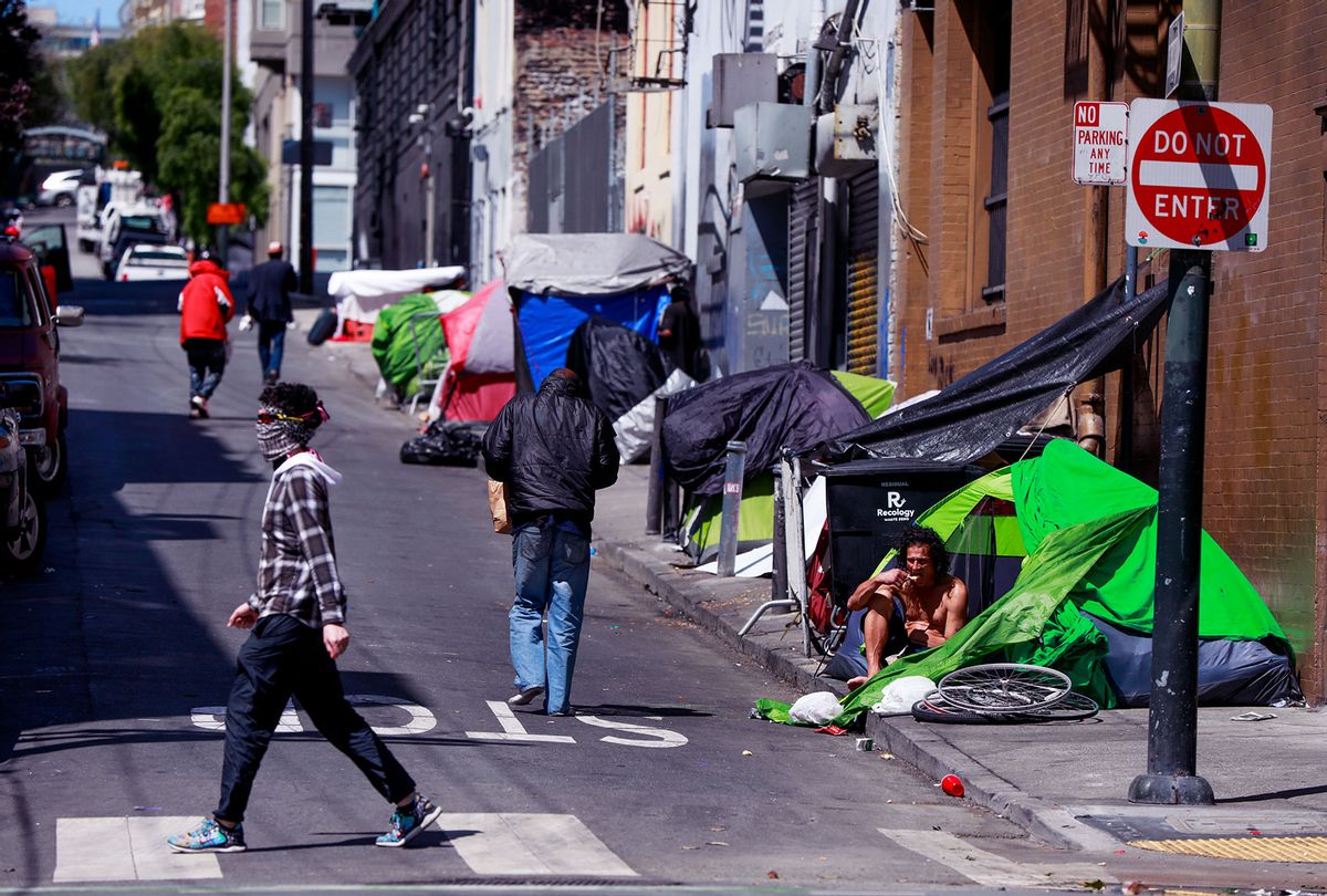 Homeless people gather on Willow Street in the Tenderloin on Wednesday, May 6, 2020 in San Francisco, California. (Gabrielle Lurie/The San Francisco Chronicle via Getty Images)