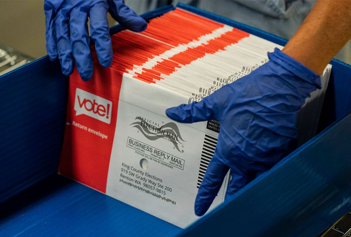 An elections worker sorts unopened ballots at the King County Elections headquarters on August 4, 2020 in Renton, Washington. (David Ryder/Getty Images)