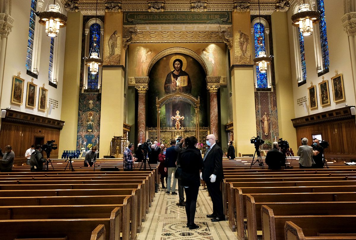 People attend a press conference with the Archbishop of New York, Cardinal Timothy Dolan, at Our Saviour Parish in Manhattan regarding the reopening of churches in the archdiocese amid the coronavirus pandemic on May 21, 2020 in New York City (Spencer Platt/Getty Images)