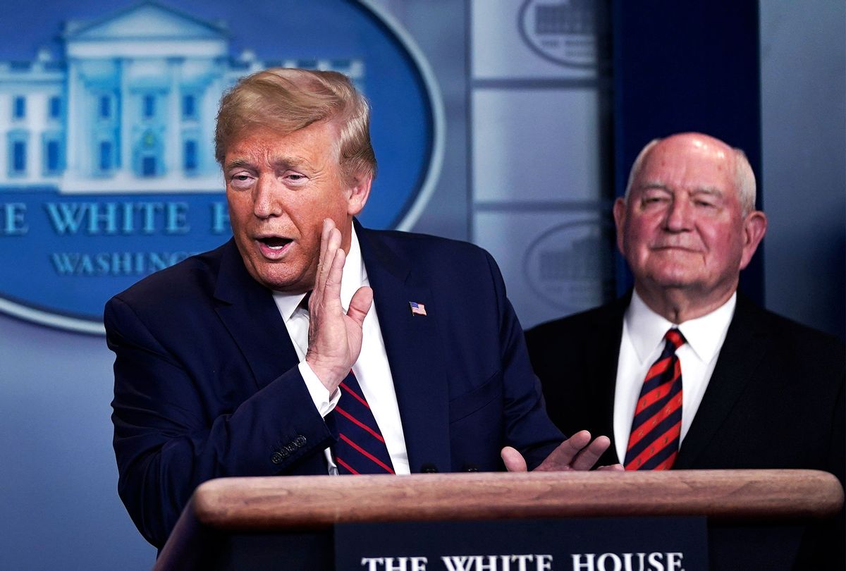 U.S. President Donald Trump speaks as Secretary of Agriculture Sonny Perdue looks on during a briefing on the coronavirus pandemic in the press briefing room of the White House. (Drew Angerer/Getty Images)