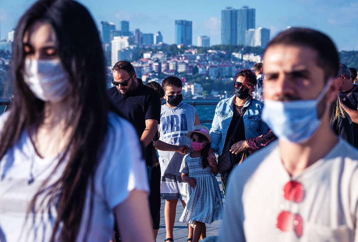 People going about leisure activities on a Sunday afternoon and daily routines while wearing face masks (Diego Cupolo/NurPhoto via Getty Images)