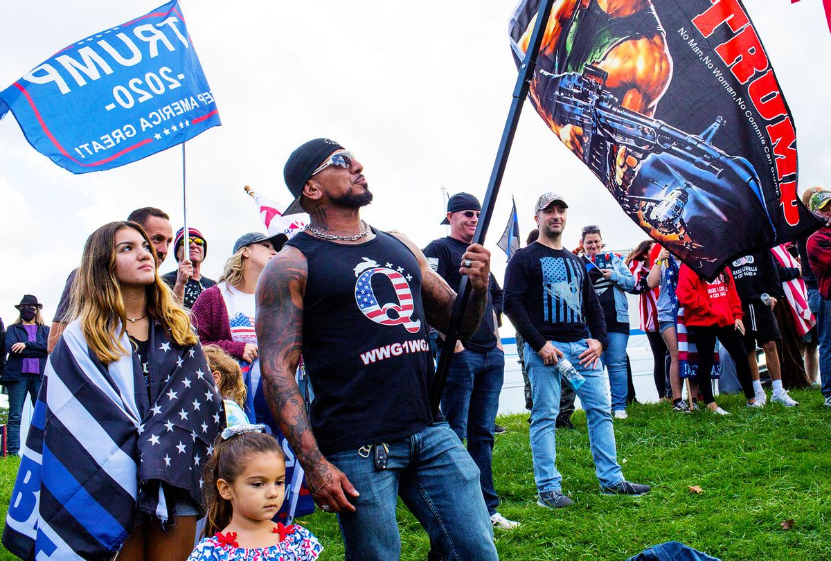 QAnon supporters attend a Trump rally hosted by Long Island and New York City police unions in support of the police on October 4, 2020 in Suffolk County, New York. (Andrew Lichtenstein/Corbis via Getty Images)