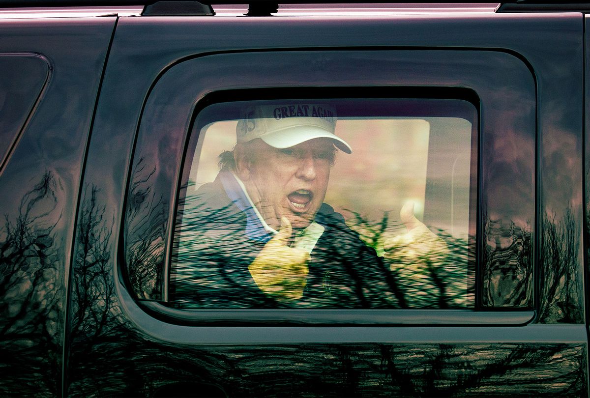 U.S. President Donald Trump gives thumbs up to supporters from this motorcade after he golfed at Trump National Golf Club on November 22, 2020 in Sterling, Virginia. The previous day President Donald Trump left the G20 summit virtual event “Pandemic Preparedness” to visit one of his golf clubs as the virus has now killed more than 250,000 Americans. (Tasos Katopodis/Getty Images)