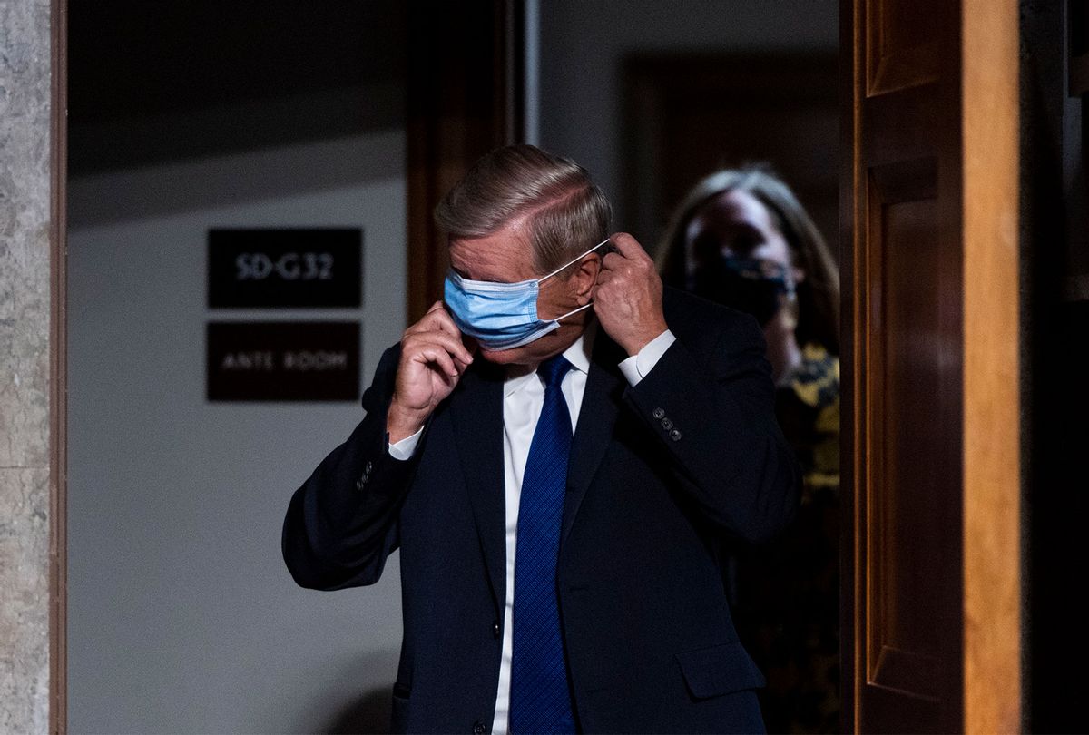 Chairman Sen. Lindsey Graham, (R-SC), puts on his face mask as he arrives for a Senate Judiciary Committee hearing. (Bill Clark-Pool/Getty Images)