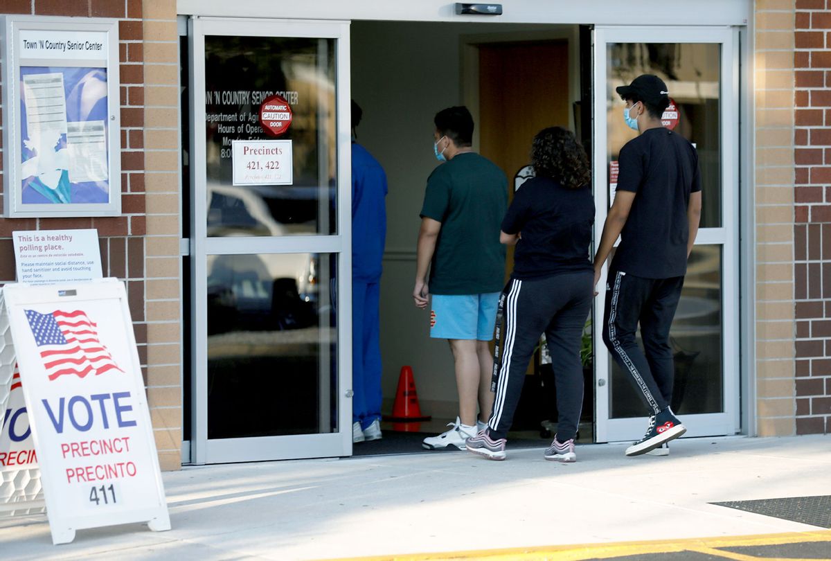 Voters wait in line to cast their ballots at the Town 'N Country Regional Public Library on November 3, 2020 in Tampa, Florida.  (Octavio Jones/Getty Images)