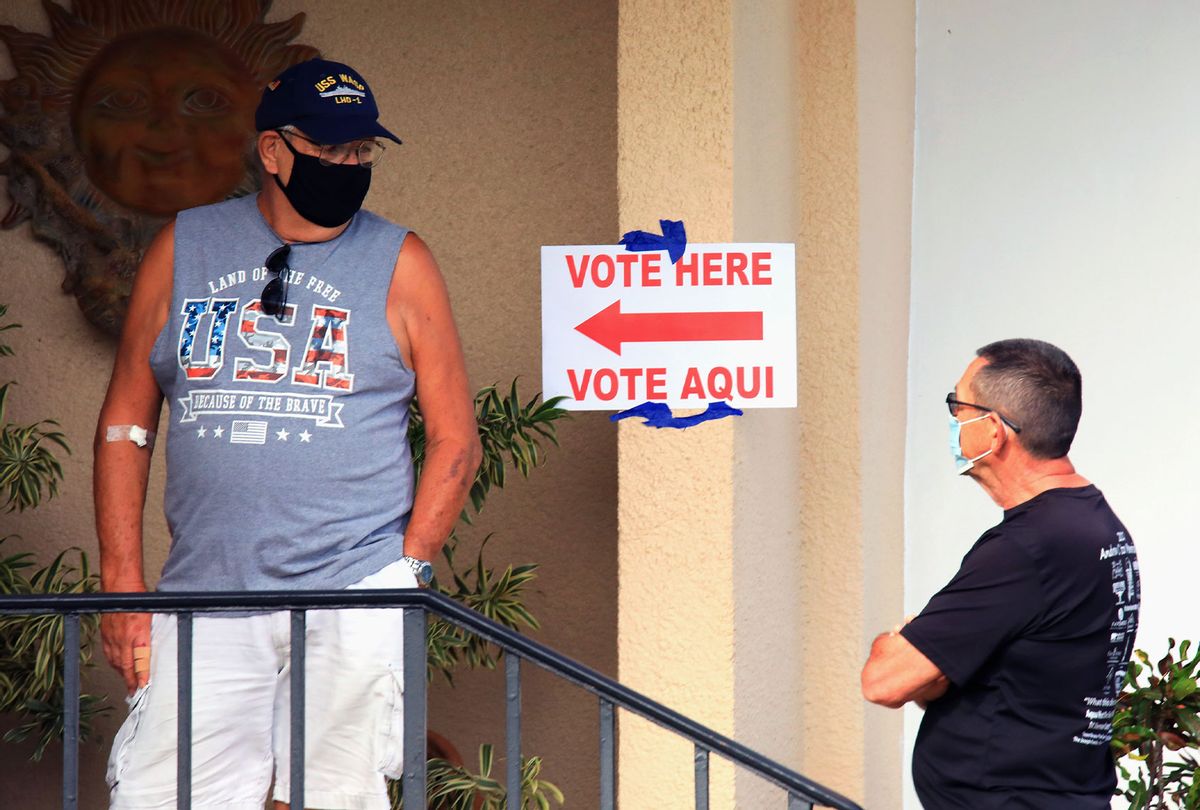 Voters wait in line to cast their vote at the Covered Bridge Condominiums on November 03, 2020 in Lake Worth, Florida. After a record-breaking early voting turnout, Americans head to the polls on the last day to cast their vote for incumbent U.S. President Donald Trump or Democratic nominee Joe Biden in the 2020 presidential election. (Bruce Bennett/Getty Images)