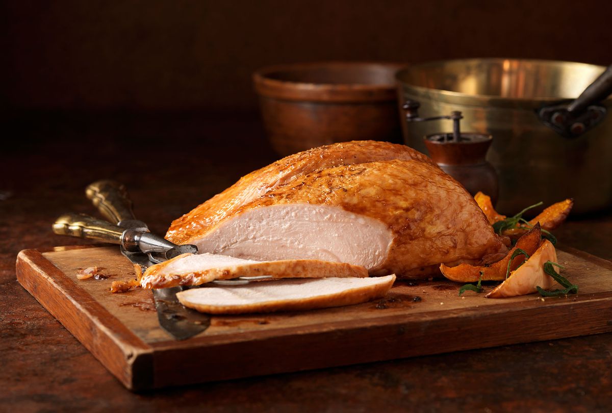 Roasted turkey breast on chopping board (Getty Images)