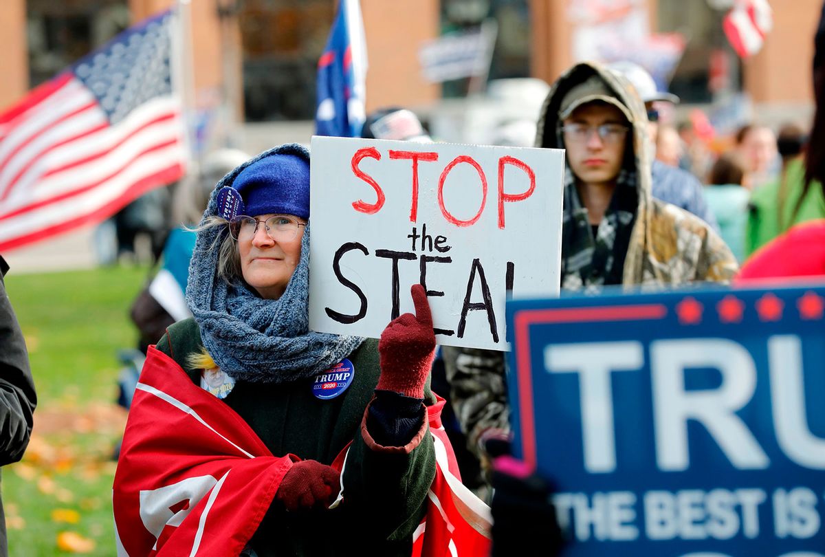 People gather at the Michigan State Capitol for a "Stop the Steal" rally in support of US President Donald Trump on November 14, 2020, in Lansing, Michigan. - Supporters are backing Trump's claim that the November 3 election was fraudulent. (JEFF KOWALSKY/AFP via Getty Images)