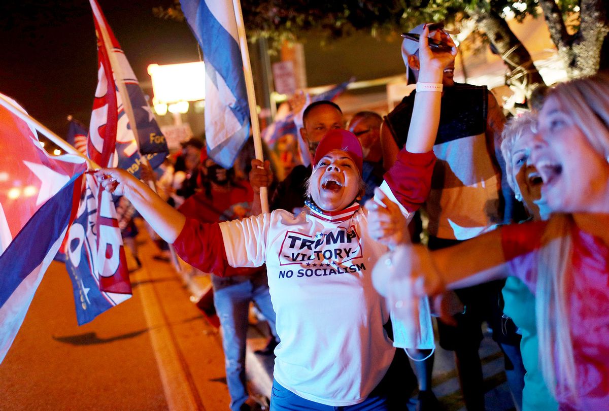 Supporters of U.S. President Donald Trump cheer outside of the Versailles restaurant as they await the results of the presidential election on November 03, 2020 in Miami, Florida. (Joe Raedle/Getty Images)