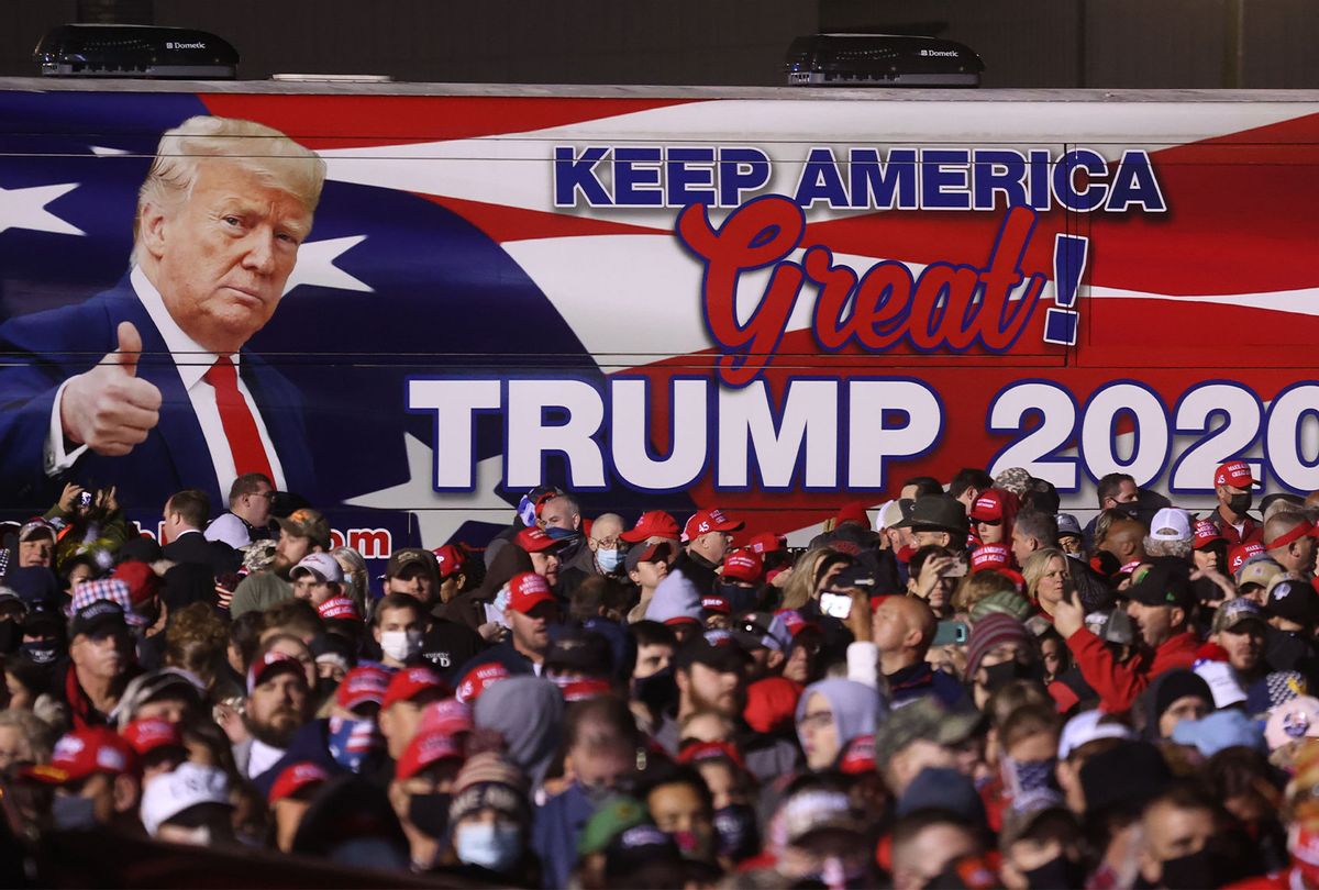 A bus with an image of U.S. President Donald Trump sits next to the crowd during a campaign rally at Richard B. Russell Airport on November 01, 2020 in Rome, Georgia. With two days to go until election day, Donald Trump is campaigning in Michigan, Iowa, North Carolina, Georgia and Florida. (Justin Sullivan/Getty Images)