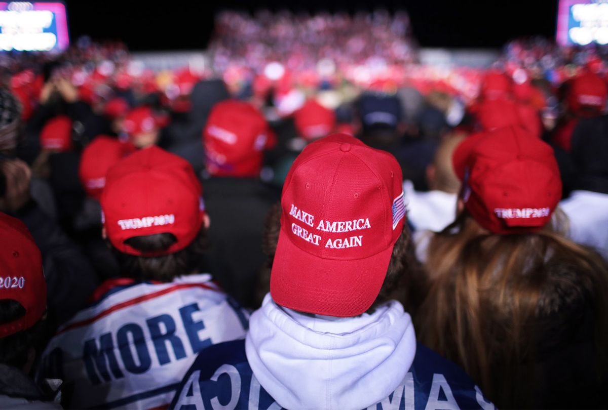 Supporters listen as President Donald Trump speaks during a campaign rally at the Kenosha Regional Airport on November 02, 2020 in Kenosha, Wisconsin. Trump, who won Wisconsin with less than 1 percent of the vote in 2016, currently trails former vice president and Democratic presidential candidate Joe Biden in the state according to recent polls. (Scott Olson/Getty Images)