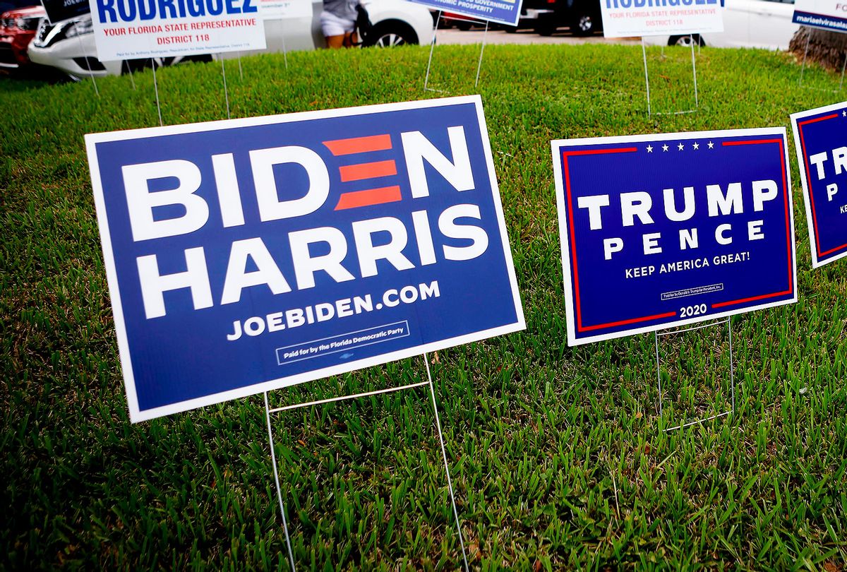 Campaign signs are seen at Westchester Regional Library in Miami, Florida on October 19, 2020. (EVA MARIE UZCATEGUI/AFP via Getty Images)