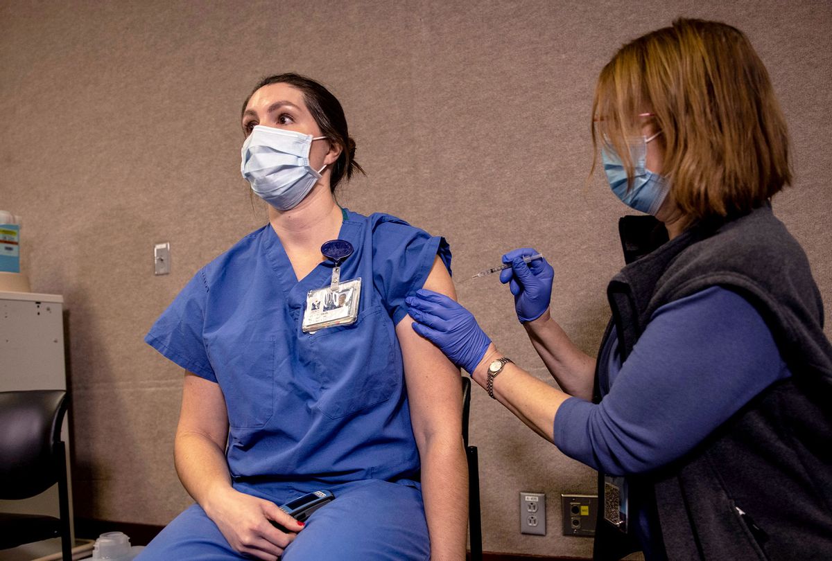 Brigid Yoder, Neuro Trauma ICU nurse, gets the Pfizer-BioNTech COVID-19 vaccination at the Legacy Emanuel Medical Center on December 16, 2020 in Portland, Oregon. Today was the first day of vaccinations in Oregon. (Paula Bronstein/Getty Images)