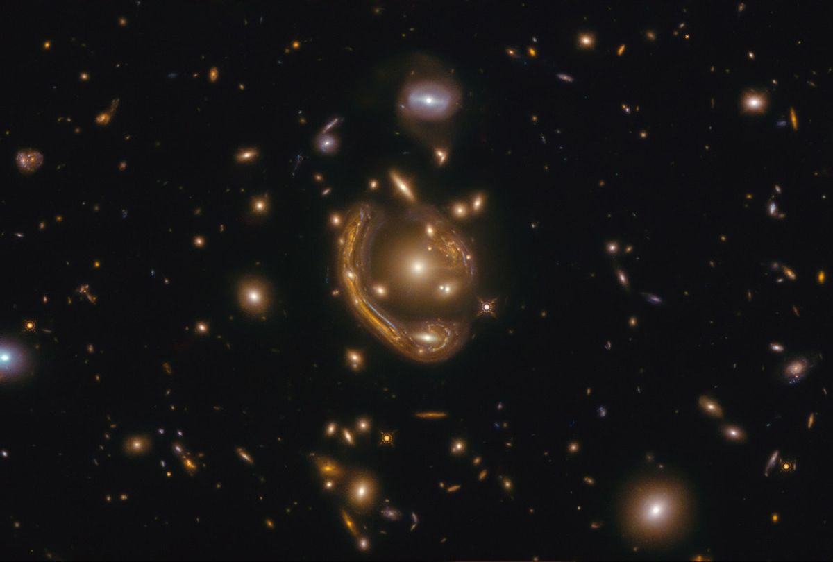 The narrow galaxy elegantly curving around its spherical companion in this image is a fantastic example of a truly strange and very rare phenomenon. This image, taken with the NASA/ESA Hubble Space Telescope, depicts GAL-CLUS-022058s, located in the southern hemisphere constellation of Fornax (the Furnace). GAL-CLUS-022058s is the largest and one of the most complete Einstein rings ever discovered in our universe. The object has been nicknamed by astronomers studying this Einstein ring as the "Molten Ring," which alludes to its appearance and host constellation. (ESA/Hubble & NASA)