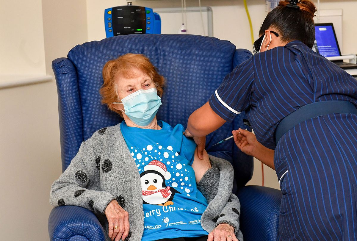 Margaret Keenan, 90, is the first patient in the United Kingdom to receive the Pfizer/BioNtech covid-19 vaccine at University Hospital, Coventry, administered by nurse May Parsons, at the start of the largest ever immunization program in the UK's history on December 8, 2020 in Coventry, United Kingdom.  (Jacob King - Pool / Getty Images)