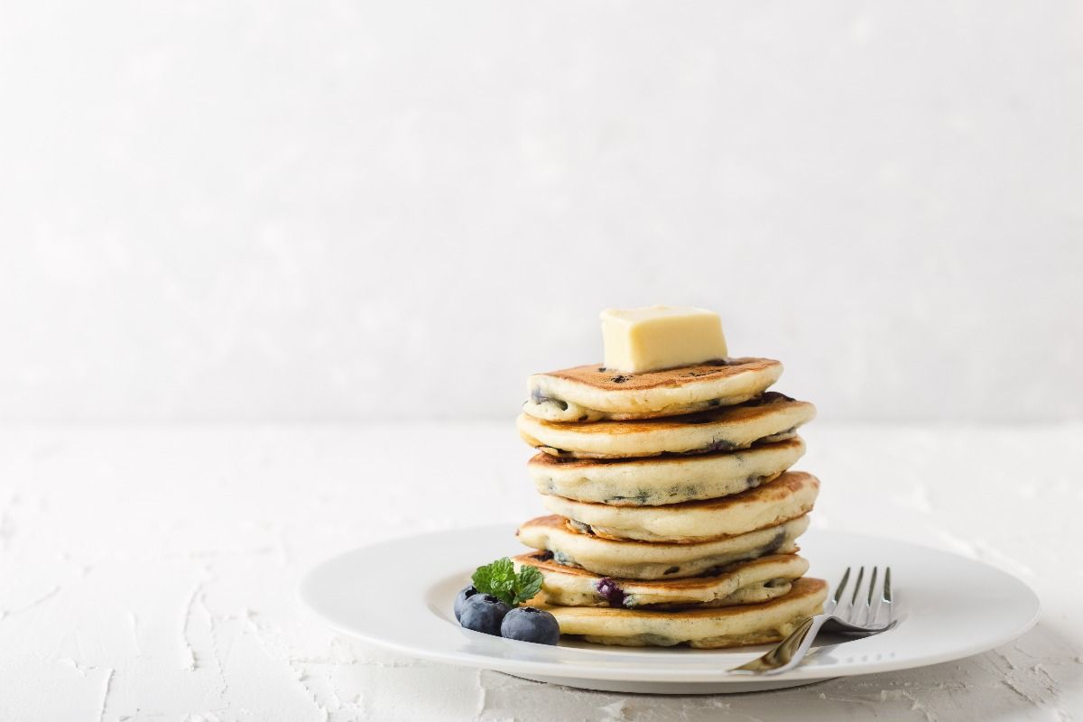Blueberry pancakes on a white holiday party table. (Getty Images)