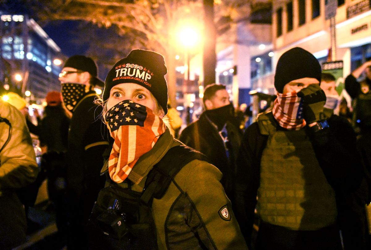 A woman with the Proud Boys wears an American flag bandana during a protest on December 12, 2020 in Washington, DC. Thousands of protesters who refuse to accept that President-elect Joe Biden won the election are rallying ahead of the electoral college vote to make Trump's 306-to-232 loss official. (Stephanie Keith/Getty Images)