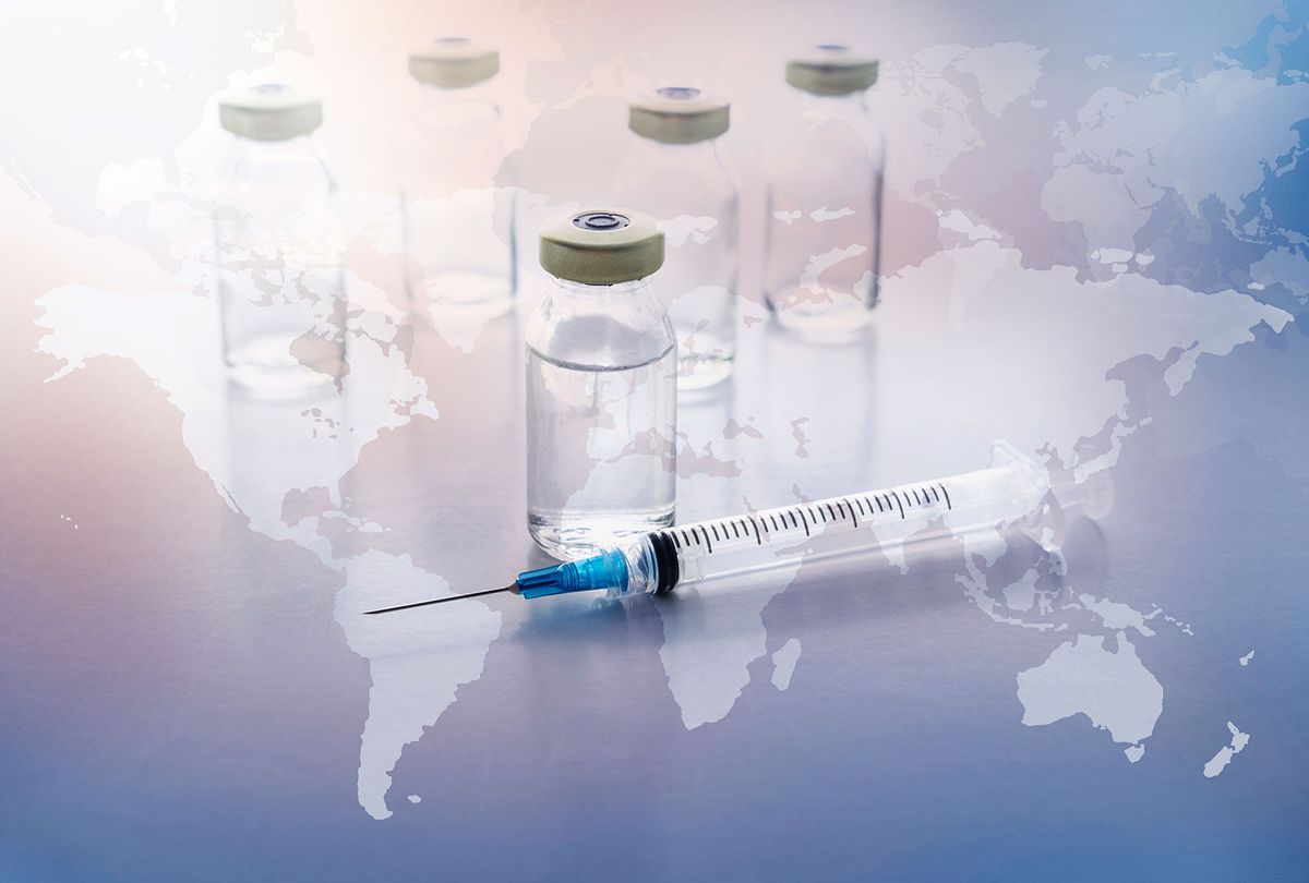 Vials and syringe with world map in background (Getty Images)