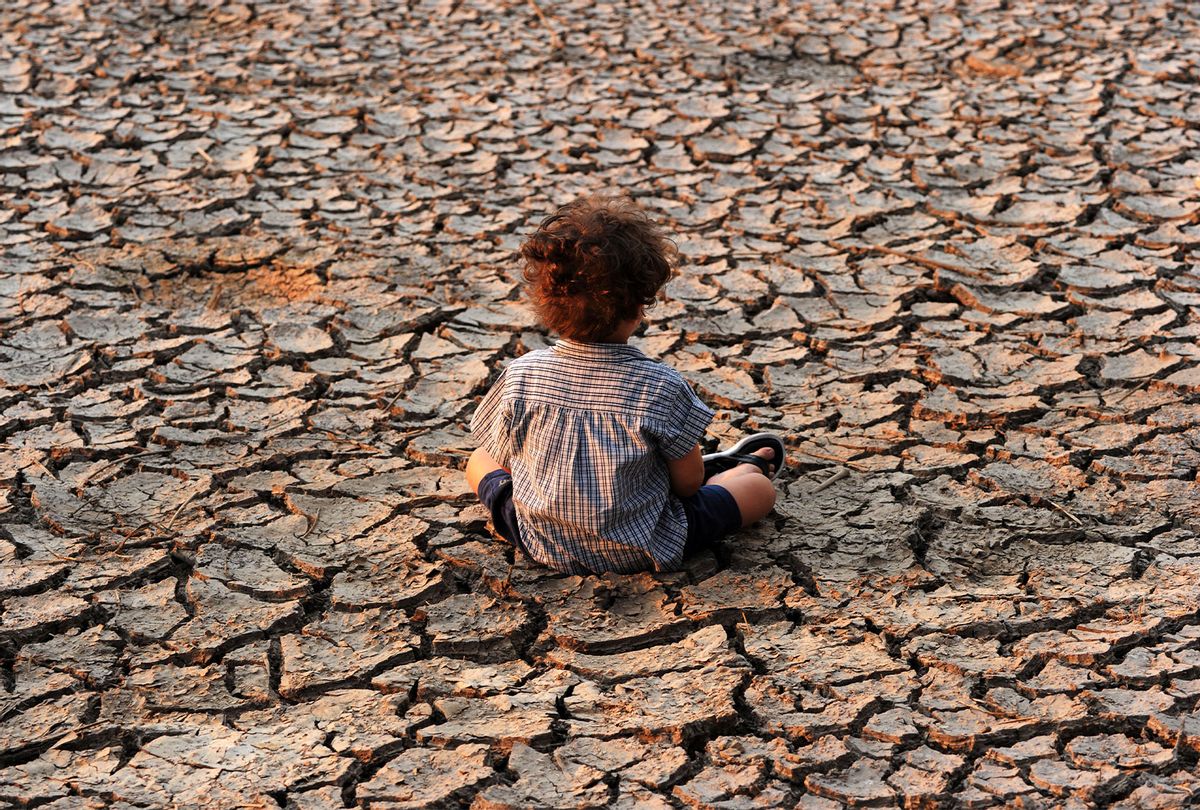 A child remains at an area affected by a drought on Earth Day in the southern outskirts of Tegucigalpa on April 22, 2016. (ORLANDO SIERRA/AFP via Getty Images)