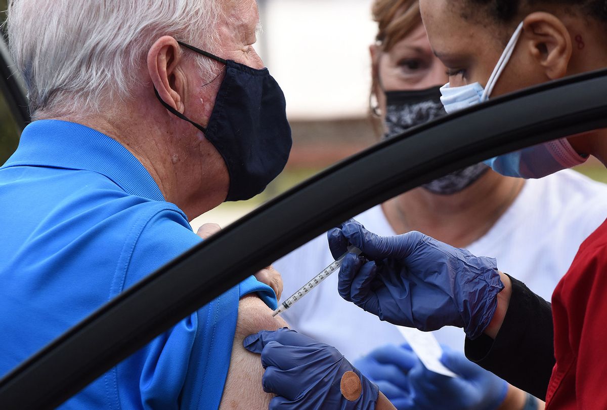 Tony Dix receives his second dose of the Moderna COVID-19 vaccine at a drive-thru vaccination site operated by the Florida Department of Health at St. Patricks Catholic Church on January 26, 2021 in Mount Dora, Florida. More than one million seniors 65 and older have been vaccinated in the state. (Paul Hennessy/NurPhoto via Getty Images))