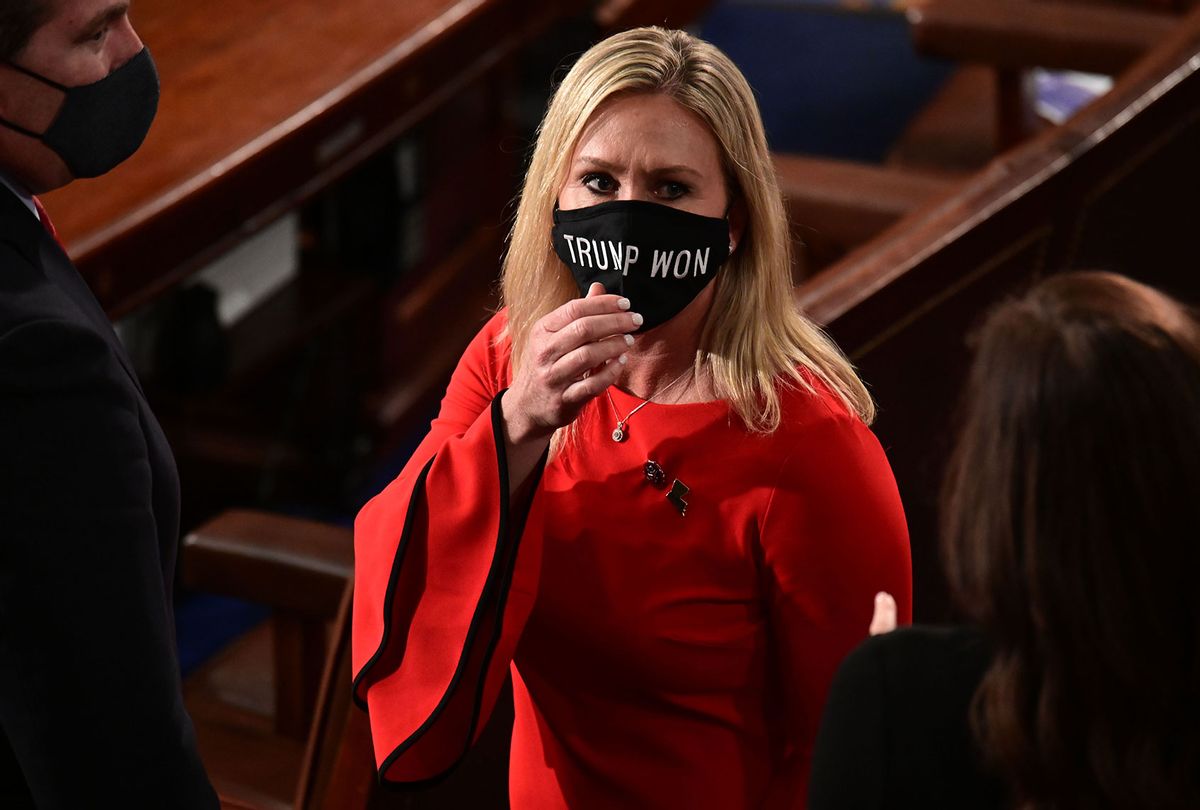 US Rep. Marjorie Taylor Greene (R-GA) wears a "Trump Won" face mask as she arrives on the floor of the House to take her oath of office as a newly elected member of the 117th House of Representatives in Washington, DC on January 3, 2021. (ERIN SCOTT/POOL/AFP via Getty Images)