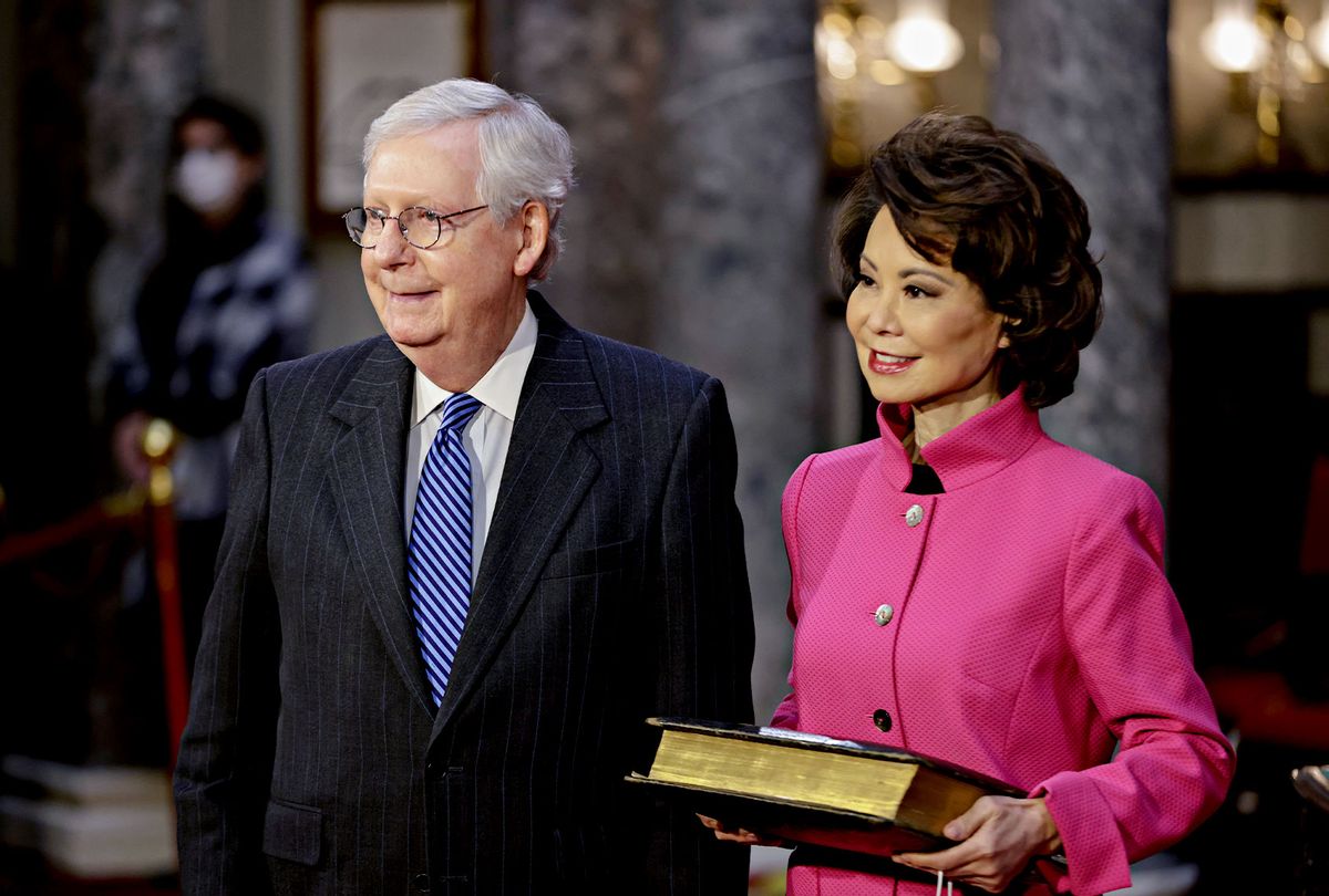Senate Majority Leader Mitch McConnell (R-KY) waits to be sworn-in with his wife Elaine Chao, U.S. Secretary of Transportation, at the U.S. Capitol on January 3, 2021 in Washington, D.C.  (Samuel Corum-Pool/Getty Images)
